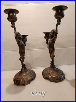 Ancienne paire de bougeoirs aux putti style Napoléon III XIXe siècle