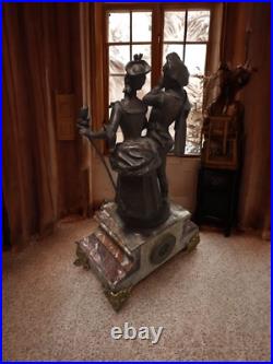 Ancienne pendulede cheminée du XIX siecle avec statue en bronze Ancienne pendulede cheminée du XIX siecle avec statue en bronze