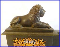 Barre de cheminée Empire en bronze patiné et doré aux lions début XIXe siècle