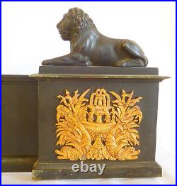 Barre de cheminée Empire en bronze patiné et doré aux lions début XIXe siècle