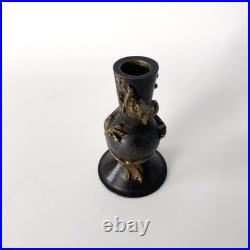 Bougeoir chinois en bronze patiné, décor au dragon impérial Fin XIXe siècle