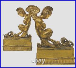 Faunes ailées formant chenets en bronze ciselé trace de dorure. XIX siècle