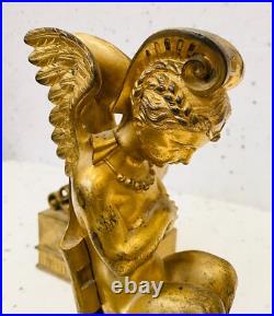 Faunes ailées formant chenets en bronze ciselé trace de dorure. XIX siècle