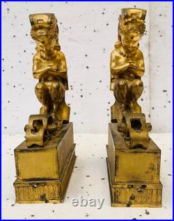 Faunes ailées formant chenets en bronze ciselé trace de dorure. XIX siècle