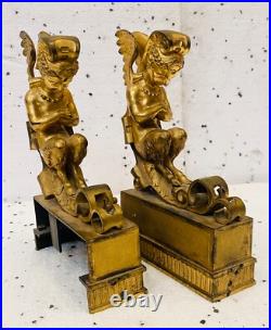 Faunes ailées formant chenets en bronze ciselé trace de dorure. XIX siècle