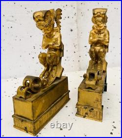 Faunes ailées formant chenets en bronze ciselé trace de dorure. XIX siècle