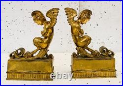 Faunes ailées formant chenets en bronze ciselé trace de dorure. XIX siècle