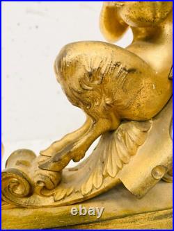 Faunes ailées formant chenets en bronze ciselé trace de dorure. XIX siècle