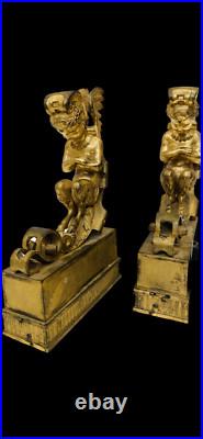 Faunes ailées formant chenets en bronze ciselé trace de dorure. XIX siècle