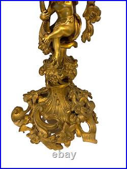 Garniture de cheminée de style Louis XV en bronze ciselé doré XIX siècle