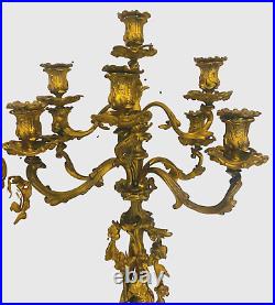 Garniture de cheminée style Louis XV en bronze doré. XIX siècle