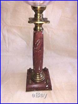 Lampe à pétrole 72 cm XIXe siècle pierre rouge et bronze