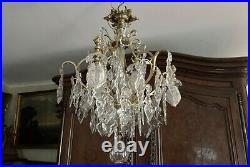 Lustre cage 6 feux bronze doré cristal taillé pampilles fleurs XIXè siècle Lustre cage 6 feux bronze doré cristal taillé pampilles fleurs XIXè siècle