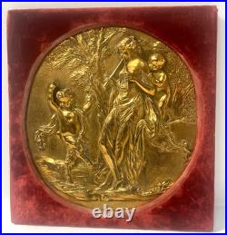 Médaillon rond a décor a l'antique en bronze doré XIX siècle