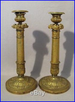 Paire de bougeoirs en bronze doré époque restauration XIX ème siècle
