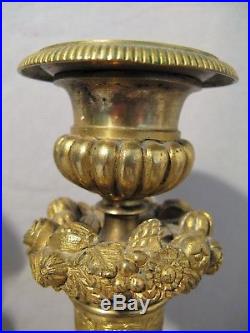 Paire de bougeoirs en bronze doré époque restauration XIX ème siècle