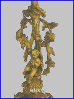 Paire de candélabres style Louis XV bronze doré à décor de putti. XIX siècle