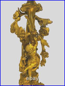 Paire de candélabres style Louis XV bronze doré à décor de putti. XIX siècle