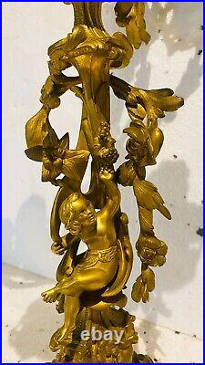 Paire de candélabres style Louis XV bronze doré à décor de putti. XIX siècle