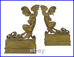 Paire de chenets en bronze doré a décor de faunes ailés XIX siècle