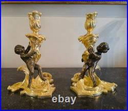 Paire de flambeaux aux putti, style Louis XV, d'après Meissonnier XIXe siècle