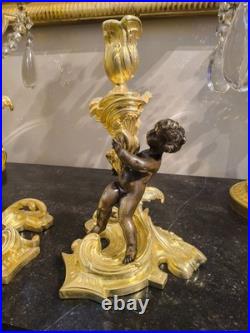 Paire de flambeaux aux putti, style Louis XV, d'après Meissonnier XIXe siècle