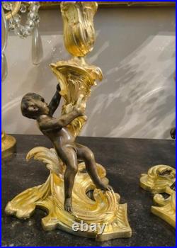 Paire de flambeaux aux putti, style Louis XV, d'après Meissonnier XIXe siècle