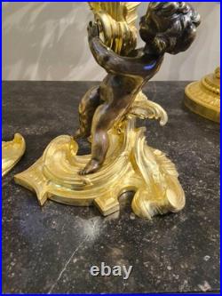 Paire de flambeaux aux putti, style Louis XV, d'après Meissonnier XIXe siècle
