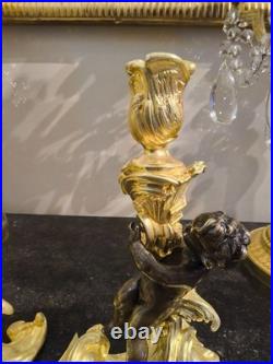 Paire de flambeaux aux putti, style Louis XV, d'après Meissonnier XIXe siècle