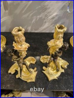 Paire de flambeaux aux putti, style Louis XV, d'après Meissonnier XIXe siècle