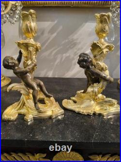 Paire de flambeaux aux putti, style Louis XV, d'après Meissonnier XIXe siècle