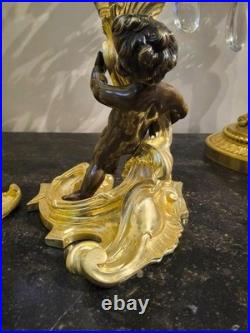 Paire de flambeaux aux putti, style Louis XV, d'après Meissonnier XIXe siècle