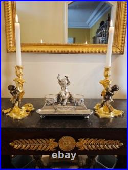 Paire de flambeaux aux putti, style Louis XV, d'après Meissonnier XIXe siècle