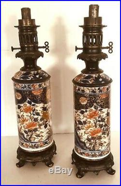 Paire de lampes à pétrole à décor Imari base en bronze ciselé. XIX siècle