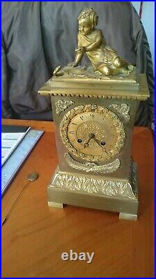 Pendule Bronze doré XIX siecle Angelot avec serpent 35cms 4kg Manque Clé