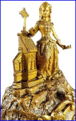 Pendule bronze dore style romantique Barbe d'Héliopolis XIXe siècle Vincenti