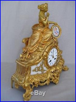 Pendule en bronze doré et plaques de porcelaine époque XIX ème siècle