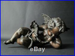 Putto en bronze soufflant dans une conque angelot musicien conch XIXe siècle